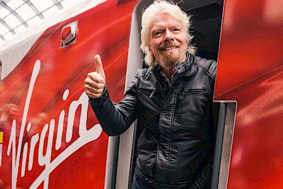 Richard Branson on a Virgin branded train