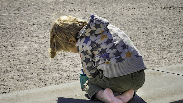 Child playing at the seaside