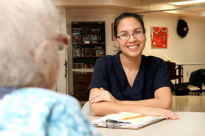 Care assistant talking to older person