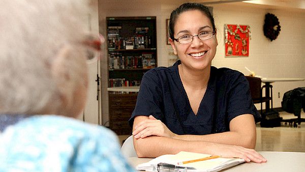 Care assistant talking to older person