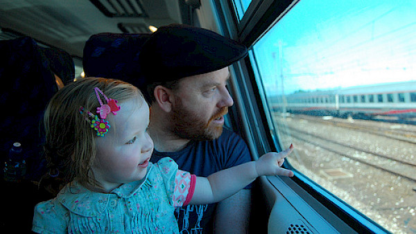 Parent and child on train