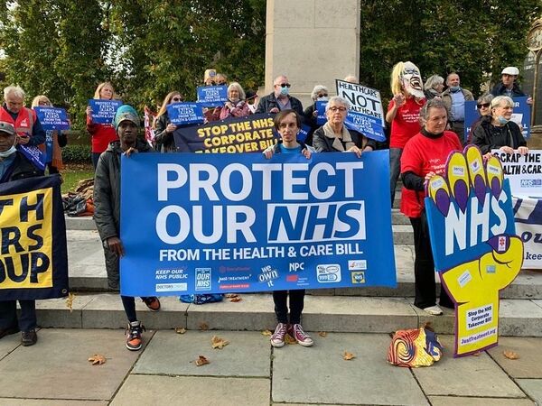 Photo of demo, crowd holding banners like Protect Our NHS from the Health and Care Bill