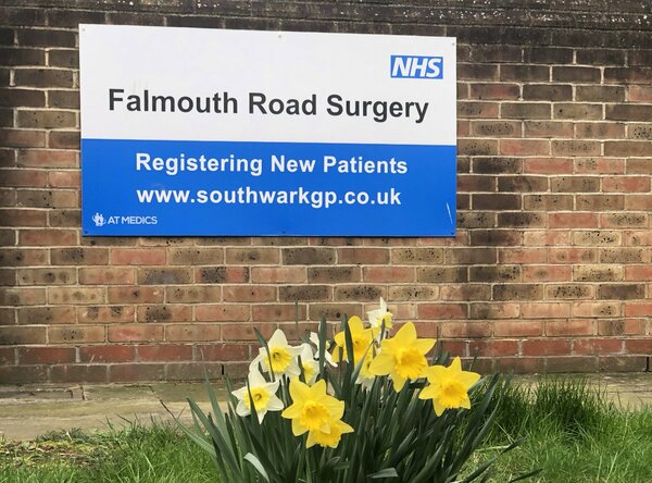 An image of an NHS signboard for Falmouth Road Surgery