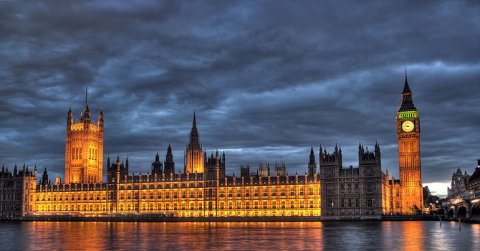 A photograph of the Houses of Parliament at night