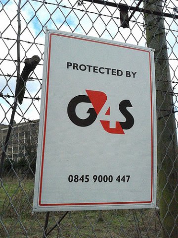 Photo of G4S sign on fence