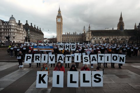 Protesters in Parliamentary Square with the message "NHS Privatisation Kills"