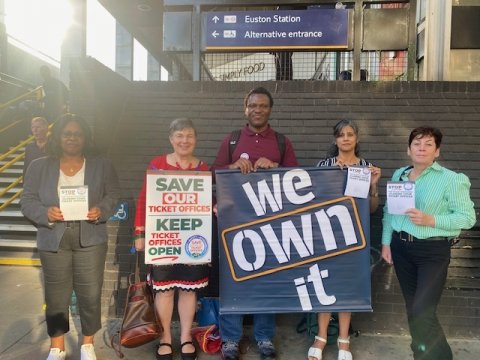 We Own It supporters protesting outside a railway station over proposals to close ticket offices.