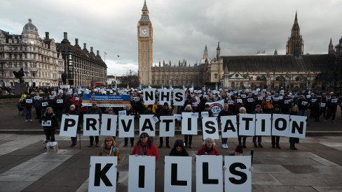Protesters in Parliamentary Square with the message "NHS Privatisation Kills"