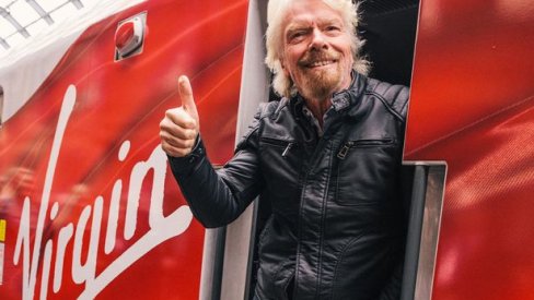 Richard Branson on a Virgin branded train