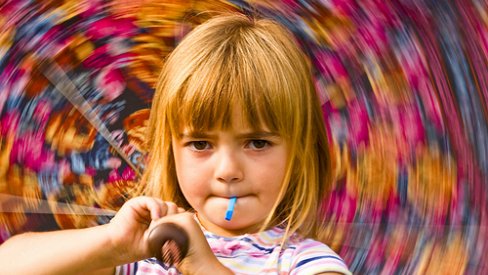 Girl twirls an umbrella